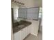 Updated bathroom vanity with granite countertops and modern fixtures at 808 Massy Ct, Kissimmee, FL 34759