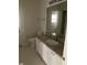 Bathroom featuring granite counters, neutral walls, a toilet, and a mirror at 808 Massy Ct, Kissimmee, FL 34759