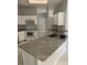 Spacious kitchen with stainless steel appliances, granite counters, a breakfast bar area, and a sink at 808 Massy Ct, Kissimmee, FL 34759