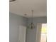 Open-concept living room with modern lighting fixtures and plenty of natural light at 808 Massy Ct, Kissimmee, FL 34759