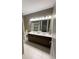 Bathroom featuring double sinks with a large mirror, and a shower/tub combination at 8919 Lakeshore Pointe Dr, Winter Garden, FL 34787