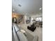 Expansive open-concept living area featuring a kitchen, dining area, and comfortable lounge space at 8919 Lakeshore Pointe Dr, Winter Garden, FL 34787