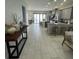 Spacious living area open to the kitchen with modern decor, perfect for entertaining and comfortable living at 8919 Lakeshore Pointe Dr, Winter Garden, FL 34787