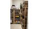 Walk-in pantry features wooden shelves and light tile flooring at 8919 Lakeshore Pointe Dr, Winter Garden, FL 34787