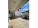 Covered patio with brick floors, outdoor furniture, and string lights at 8919 Lakeshore Pointe Dr, Winter Garden, FL 34787