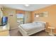 Cozy bedroom with a serene view of the outdoors through a bright window at 8942 Cuban Palm Rd, Kissimmee, FL 34747