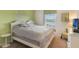 Comfortable bedroom with a calm color palette, view of the outdoors, and modern decor at 8942 Cuban Palm Rd, Kissimmee, FL 34747