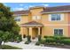 Charming townhouse exterior showcasing well-maintained landscaping and a welcoming front entrance at 8942 Cuban Palm Rd, Kissimmee, FL 34747
