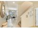 Welcoming foyer with staircase, decorative accents, and a glimpse into the open living space at 8942 Cuban Palm Rd, Kissimmee, FL 34747