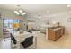 Open-concept living space featuring a dining area, modern furnishings, and natural light at 8942 Cuban Palm Rd, Kissimmee, FL 34747