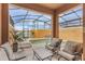 Inviting screened-in lanai with a private pool and comfortable seating area overlooking the water at 8942 Cuban Palm Rd, Kissimmee, FL 34747