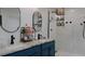 Modern bathroom with double sinks, sleek fixtures, and a glass-enclosed shower at 9345 Atlanta Dr, St Cloud, FL 34773