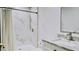 Bright bathroom featuring marble tile shower with black accents and marble vanity with modern fixtures at 9345 Atlanta Dr, St Cloud, FL 34773