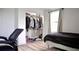 Bedroom with an open closet space for clothing and storage with a window for natural lighting at 9345 Atlanta Dr, St Cloud, FL 34773