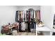 Walk-in closet with dual rods for extra hanging storage, closet organizers and make-up vanity at 9345 Atlanta Dr, St Cloud, FL 34773