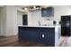 Charming kitchen features a large island, stainless appliances, modern lighting and white subway tile backsplash at 9345 Atlanta Dr, St Cloud, FL 34773