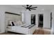 Spacious main bedroom with a view of a walk-in closet and modern ceiling fan at 9345 Atlanta Dr, St Cloud, FL 34773