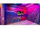 Themed bedroom with game characters, neon lighting, and unique decor create a fun, immersive experience at 1005 Coyote Creek Way, Reunion, FL 34747