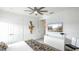 Clean bedroom with white walls, light colored carpet, and a ceiling fan at 1005 Coyote Creek Way, Reunion, FL 34747
