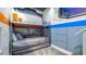 Themed bunk bedroom with unique decor and lighting creates an adventurous and playful space at 1005 Coyote Creek Way, Reunion, FL 34747