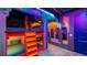 A themed bedroom features custom bunk beds with fun murals and details at 1005 Coyote Creek Way, Reunion, FL 34747