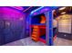 Unique bedroom with colorful custom bunk beds and neon lighting for a fun and playful atmosphere at 1005 Coyote Creek Way, Reunion, FL 34747