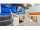 Themed bedroom features stairs to bunks, a slide, and themed decor throughout at 1005 Coyote Creek Way, Reunion, FL 34747