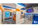 Whimsical themed bedroom with custom-built bunk beds, wall art, and slide at 1005 Coyote Creek Way, Reunion, FL 34747