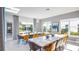 Bright dining area with multiple tables perfect for a large Gathering or group at 1005 Coyote Creek Way, Reunion, FL 34747