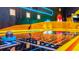 Close up on unique arcade air hockey game with colorful decor and immersive design for Gathering entertainment at 1005 Coyote Creek Way, Reunion, FL 34747