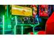 Arcade game with racing steering wheel with colorful design for Gathering entertainment at 1005 Coyote Creek Way, Reunion, FL 34747