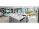 Spacious kitchen island that connects to the living room and dining area at 1005 Coyote Creek Way, Reunion, FL 34747