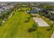 Expansive park with sand volleyball, playground, picnic area, walking paths and lush greenery for outdoor enjoyment at 1005 Coyote Creek Way, Reunion, FL 34747