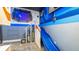 Fun playroom features a slide and themed decorations, creating an imaginative and playful space for children at 1005 Coyote Creek Way, Reunion, FL 34747
