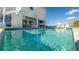 This resort style pool provides hours of enjoyment and features views of a neighboring mansion at 1005 Coyote Creek Way, Reunion, FL 34747