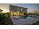 Back of house shows a pool and hot tub with a table and chairs under the lanai, with lounge chairs around the pool at 1005 Coyote Creek Way, Reunion, FL 34747