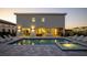 Back of house shows a pool and hot tub with a table and chairs under the lanai, with lounge chairs around the pool at 1005 Coyote Creek Way, Reunion, FL 34747