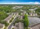 Aerial view of the community with lush landscaping and a beautiful pond at 10746 Regent Square Dr # 1502, Orlando, FL 32825