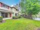 View of the townhome backyard featuring a lake view and patio at 10746 Regent Square Dr # 1502, Orlando, FL 32825