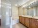 Bright bathroom features a double sink vanity, soaking tub and separate shower at 10746 Regent Square Dr # 1502, Orlando, FL 32825