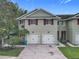 Beautiful townhome exterior with brick driveways and a well-kept lawn at 10746 Regent Square Dr # 1502, Orlando, FL 32825