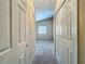 Hallway view of a room with neutral carpet, large closet and window at 10746 Regent Square Dr # 1502, Orlando, FL 32825