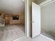 Open floor plan showcasing the staircase and kitchen from the living room at 10746 Regent Square Dr # 1502, Orlando, FL 32825