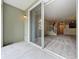 The sliding glass doors offer a view of the carpeted living room and staircase at 10746 Regent Square Dr # 1502, Orlando, FL 32825