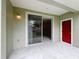 The outdoor patio space has a door and sliding glass doors with a view of the backyard at 10746 Regent Square Dr # 1502, Orlando, FL 32825