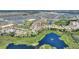 Residential aerial view showing interconnected streets, scenic ponds, and lush green spaces within the community at 1101 Downswing Pl, Davenport, FL 33896