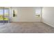 Bright bedroom with carpet, lots of natural light, and slider to a patio at 1101 Downswing Pl, Davenport, FL 33896