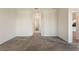 Bedroom with carpet and view to the ensuite bathroom and additional rooms at 1101 Downswing Pl, Davenport, FL 33896