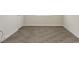 Hard surface flooring with white base trim in a hallway at 1101 Downswing Pl, Davenport, FL 33896
