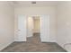 Tile flooring in a hallway with white walls and base trim at 1101 Downswing Pl, Davenport, FL 33896